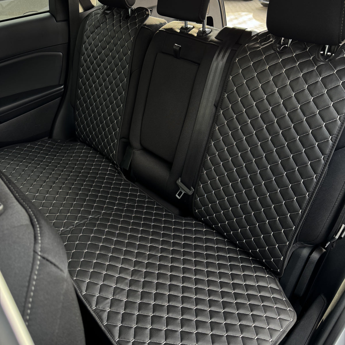 Накидки з перфорованої екошкіри “Чорний ромб із сірою ниткою”